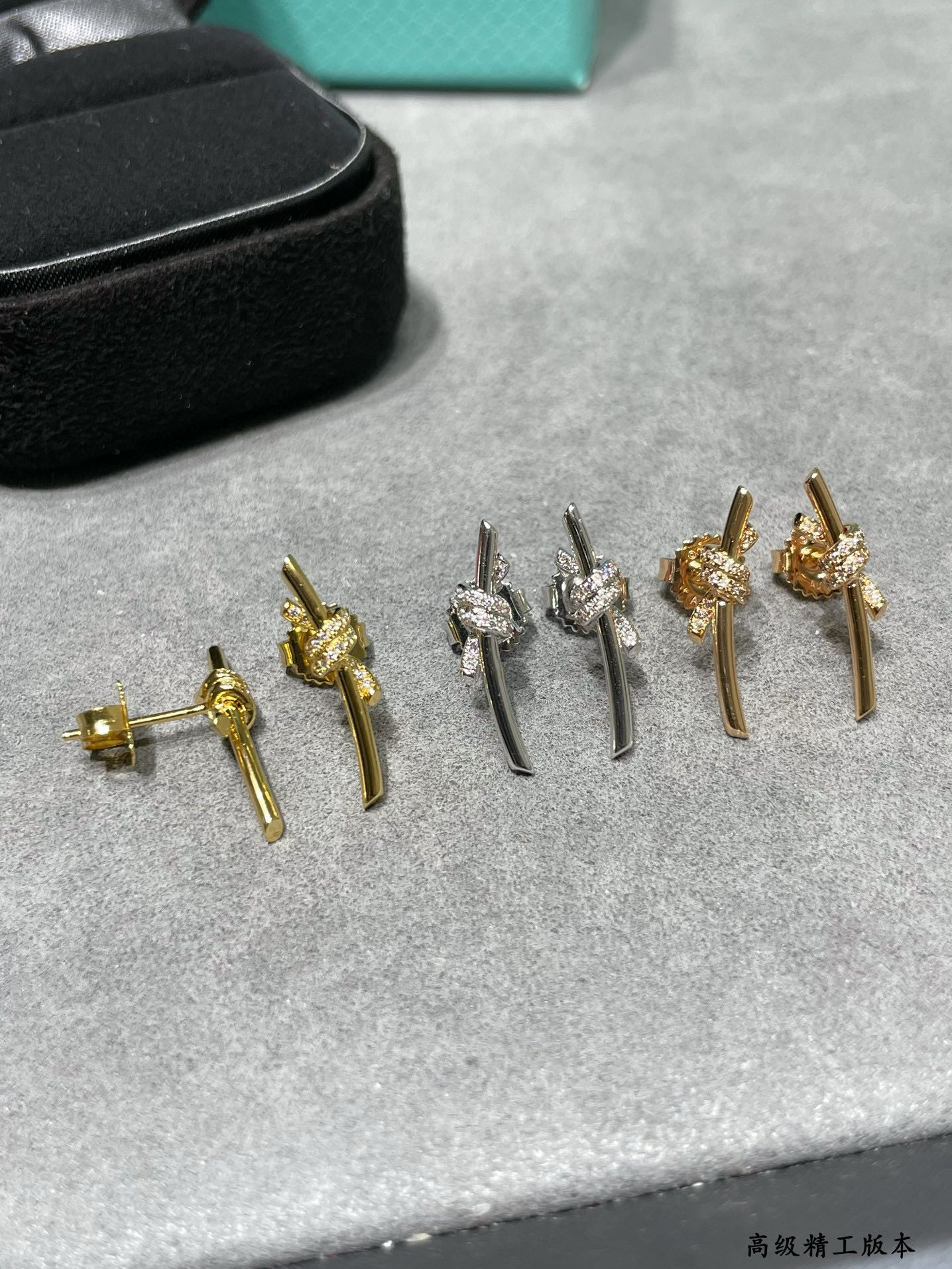 t*f*ny & co. half-Di*m*nd t wire knot stud earrings