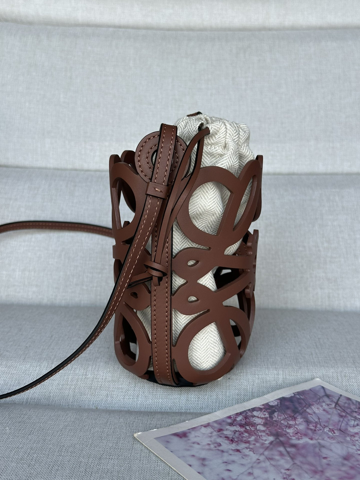 L0ew* anagram cut-out pocket in classic calfskin and canvas 20x11x8cm