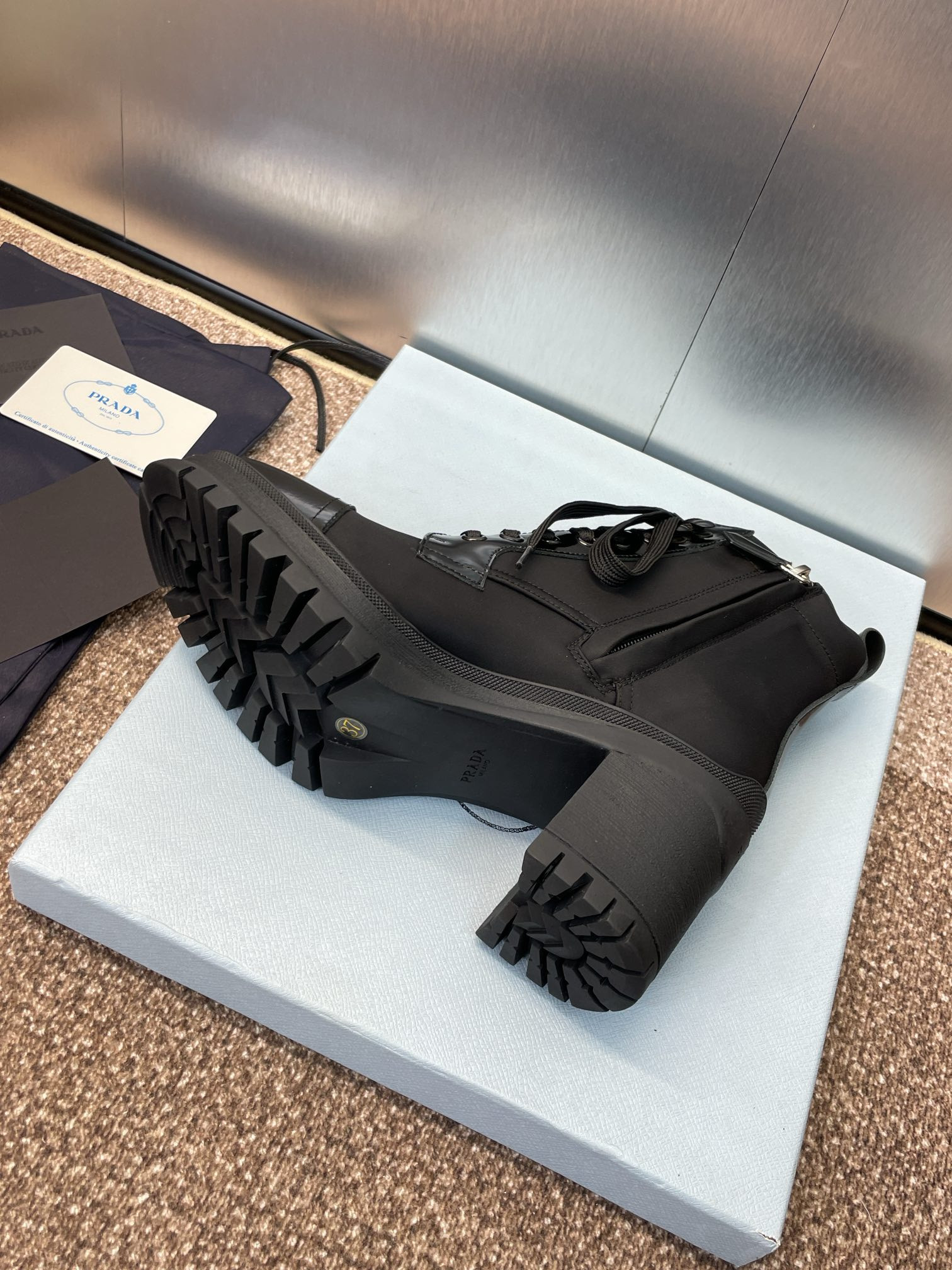 ua Pra*a re-nylon and leather booties